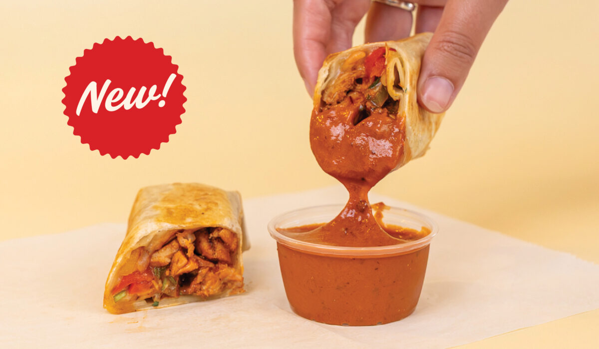 Anna's Taqueria Chipotle Chicken Taquito dipped in chipotle sauce